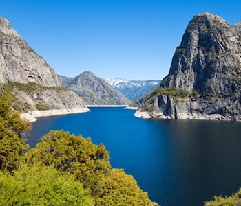 Reservoir surrounded by granite cliffs