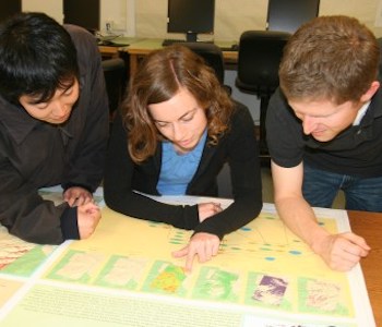 Students inspecting a plotted GIS map